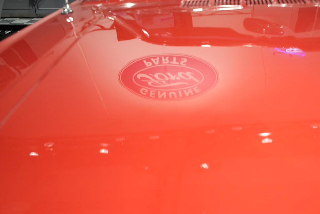 Restored 1964 1/2  mustang convertible _hood reflection_Ford Display_The SEMA Show 2011_11/4/11