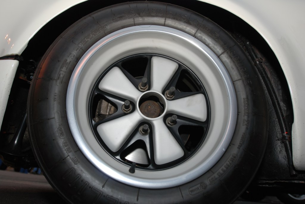 White, modified 1970's vintage Porsche 911 w/flared fenders_rear fuchs wheel with long studs_Cars&Coffee/Irvine_3/31/12 