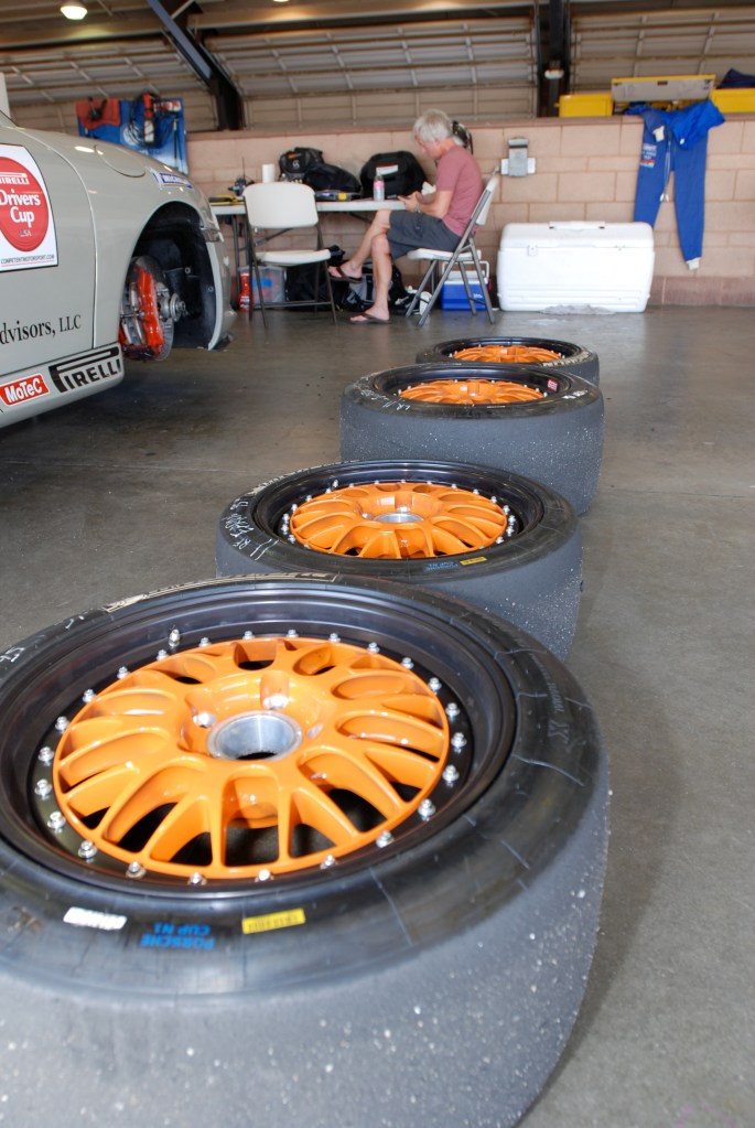 Khaki colored, Porsche GT3 Cup car_with wheels removed_Festival of Speed_Auto Club Speedway_April 21, 2012