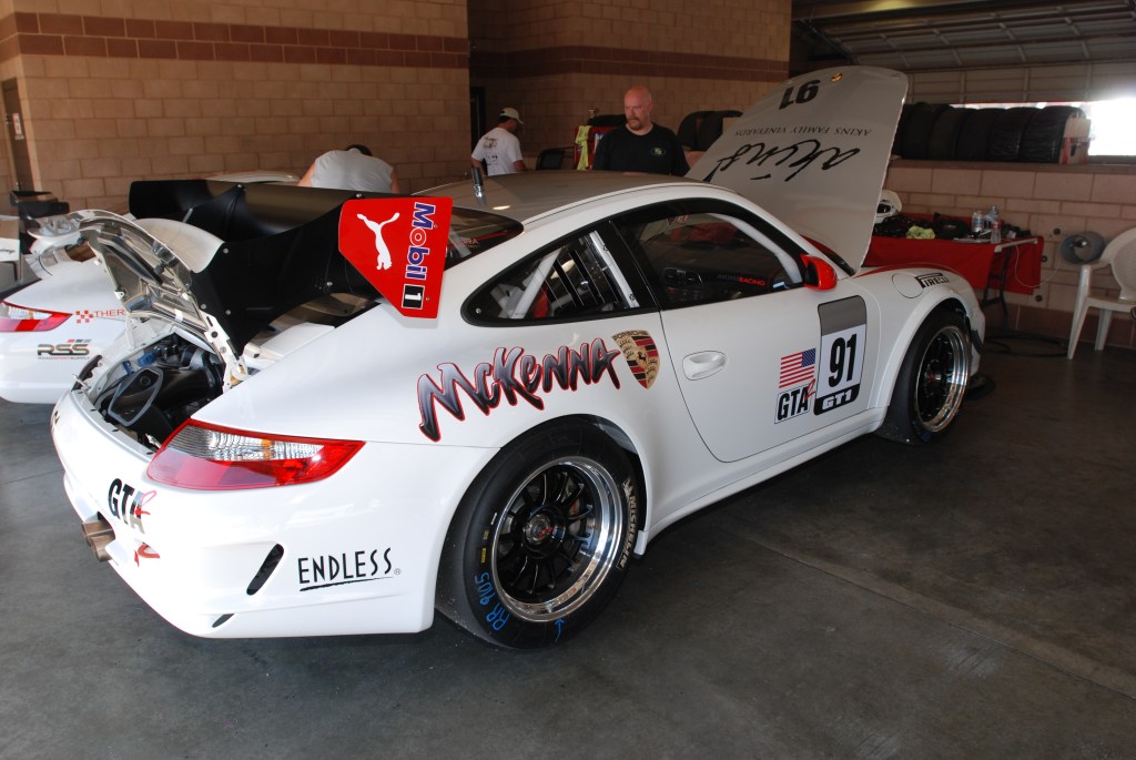 White 2012 Porsche GT3 Cup car_McKEnna graphics_Porsche GT3 Cup car_Truspeed_3/4 rear view_Festival of Speed_Auto Club Speedway_April 21, 2012