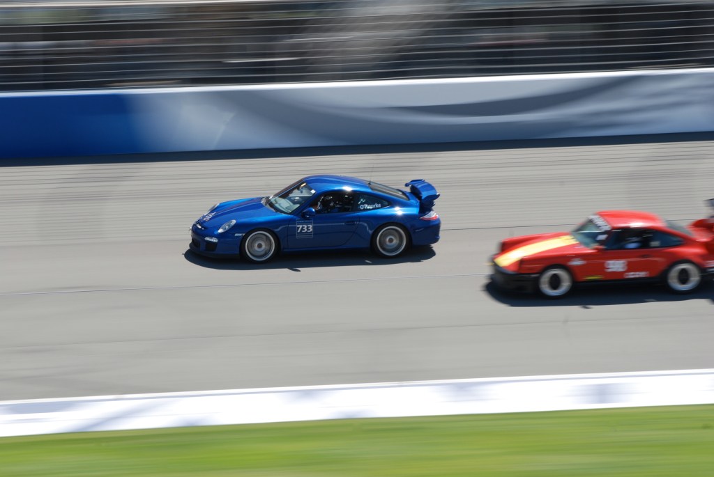Blue 2011 Porsche GT3 & Red w/ yellow stripe hood 911_Festival of Speed_Auto Club Speedway_April 21, 2012