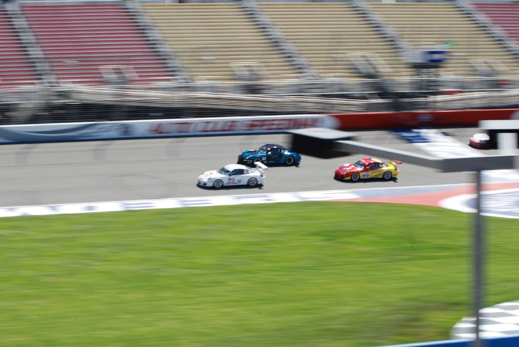 Porsche GT3 Cup cars_GT2A class_ accelerating across the start/finish line_Festival of Speed_Auto Club Speedway_April 21, 2012