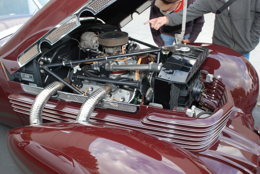 Burgundy 1937 Cord 812 convertible_detail of pontoon fender, engine, exhaust pipes and reflections_Cars&Coffee_May 26, 2012