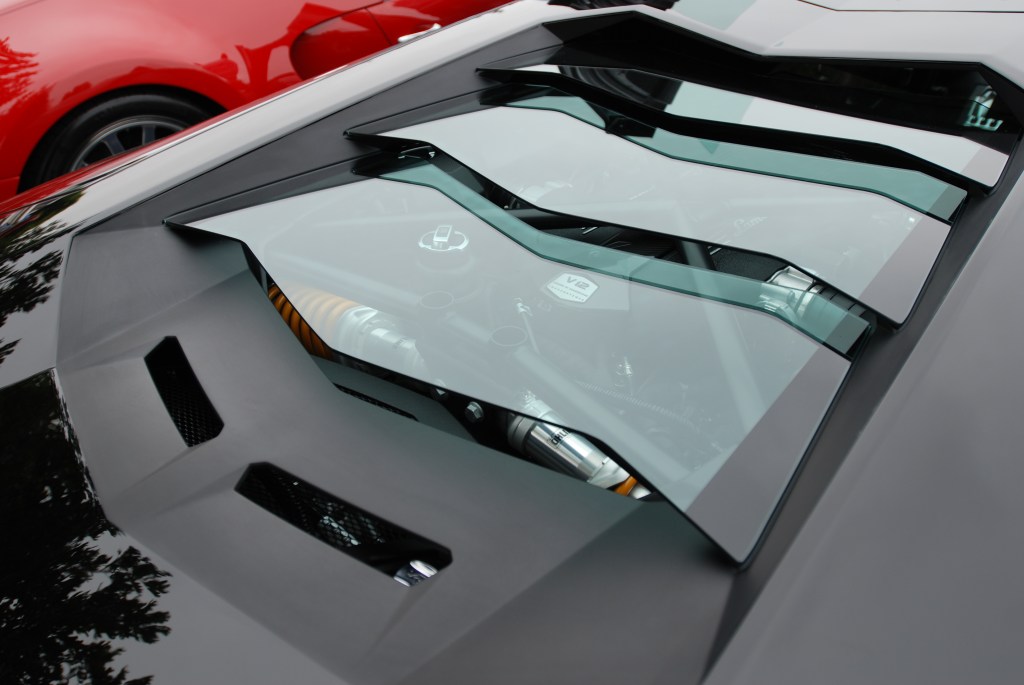 Black Lamborghini Aventador LP 700-4_3/4 rear view with green glass louvers_Cars&Coffee/Irvine_June 23, 2012