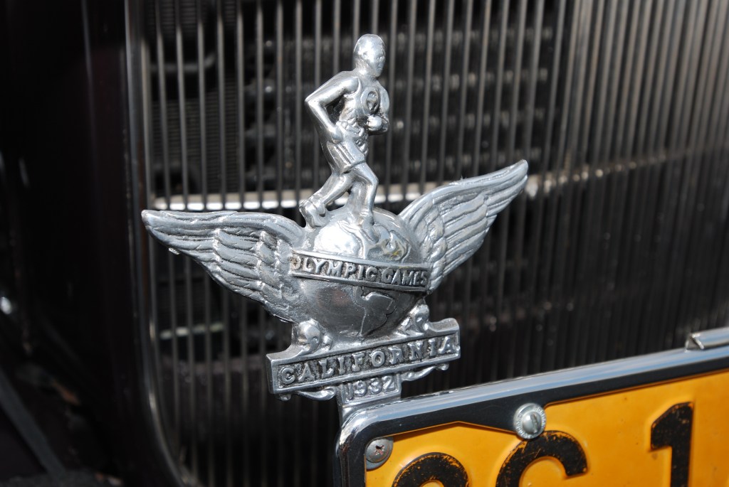1932 Ford 4 door sedan_Olympic games of Los Angeles, Ca. 1932, commemorative grill badge_Ruby's Diner car show_ Whittier,California_August 3, 2012 1932 Ford 4 door sedan_Olympic games of Los Angeles, Ca. 1932, commemorative grill badge_Ruby's Diner car show_ Whittier,California_August 3, 2012