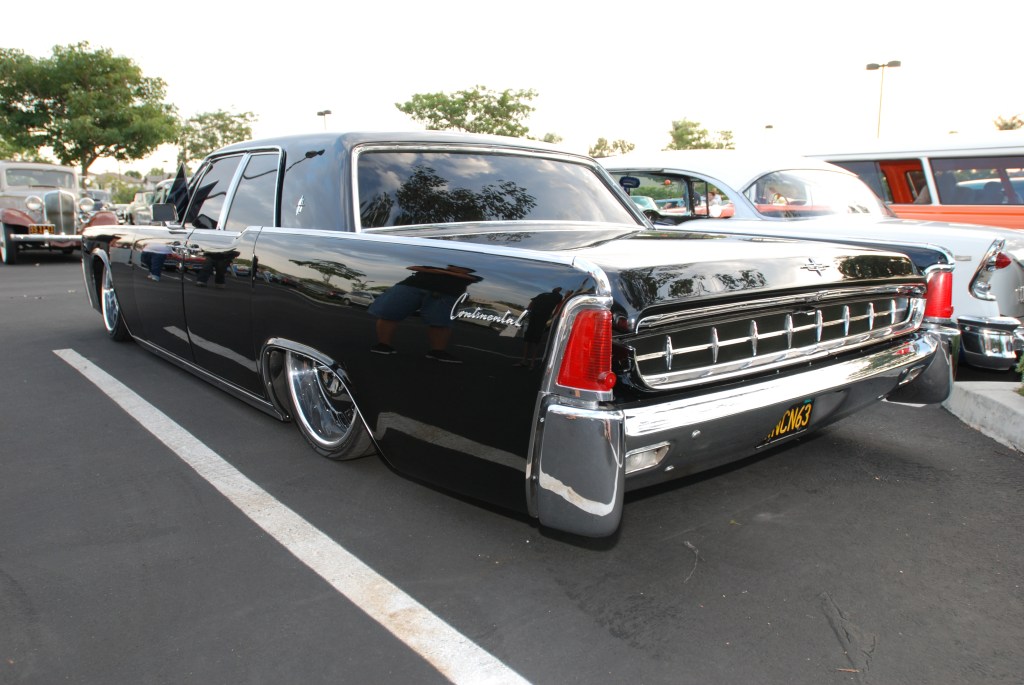 Black 1963 custom Lincoln Continental _3/4 rear view w/ reflections_Ruby's Diner car show_ Whittier,California_August 3, 2012 Black 1963 custom Lincoln Continental _3/4 rear view w/ reflections_Ruby's Diner car show_ Whittier,California_August 3, 2012