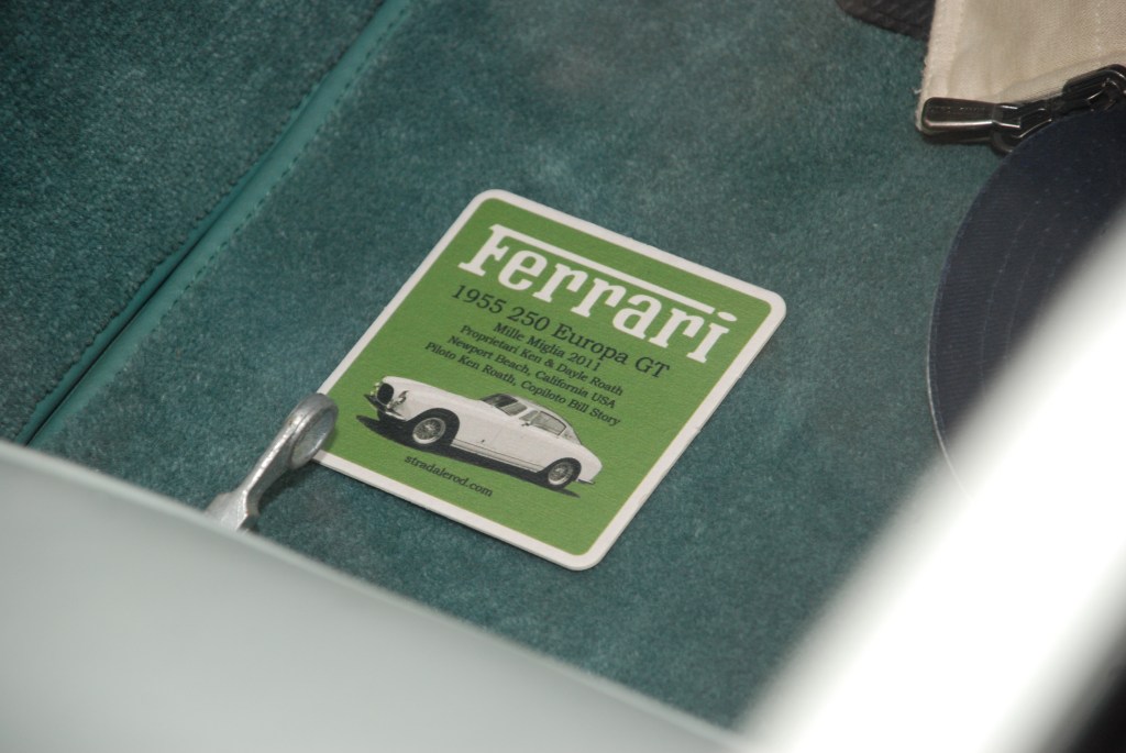 White and teal green 1955 Ferrari 250 Europa GT_interior carpet detail and Mille Miglia 2011 commemorative placard__Cars&Coffee/Irvine_August 25, 2012