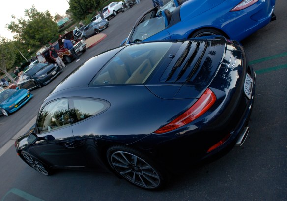 Dark Blue metallic 2013 Porsche type 991, 911 Carrera_3/4 rear view with sunrise reflections_Cars&Coffee/Irvine_January 12, 2013
