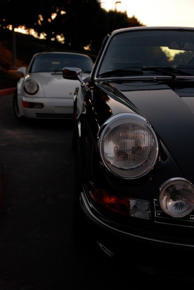 Black 1973 Porsche 911 Carrera RS & white1991 Porsche 964 turbo_ Carrera RS headlight & hood reflections_Cars&Coffee/Irvine_January 19, 2013