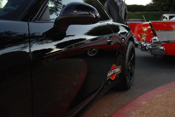 Black 2013 Porsche type 991 / 911 Carrera_side view with sunrise and red chevrolet reflections_Cars&Coffee/Irvine_January 19, 2013