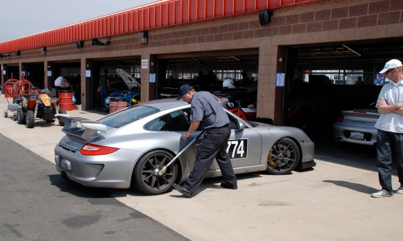 Silver Porsche GT3_re-torquing the wheels_Garage 3_3/4 rear view_California Festival of Speed_April 6, 2013