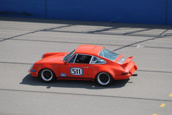 Tangerine colored Porsche 911 race car #511 at speed_California Festival of Speed_April 6, 2013