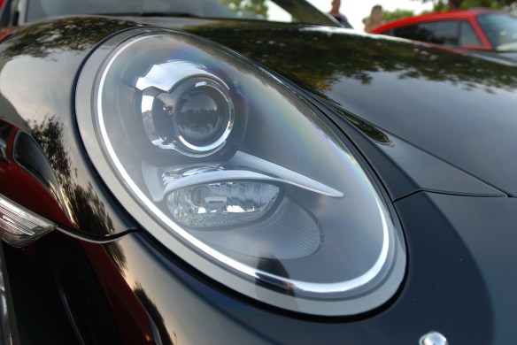 Black 2013 Porsche 991 Carrera S_headlight, fender and hood reflections_Cars&Coffee/irvine_April 27, 2013
