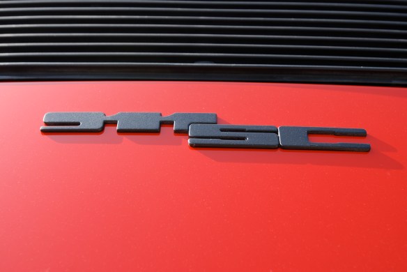 Sumner's 1983 India red Porsche 911SC_ rear decklid badge detail_Cars&Coffee/Irvine_April 27, 2013
