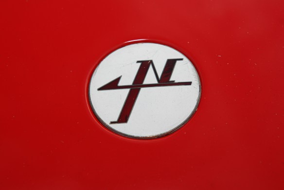 Red & white 1967 Nissan R380-ii sports prototype_front nose emblem_ Cars&Coffee_August 31, 2013