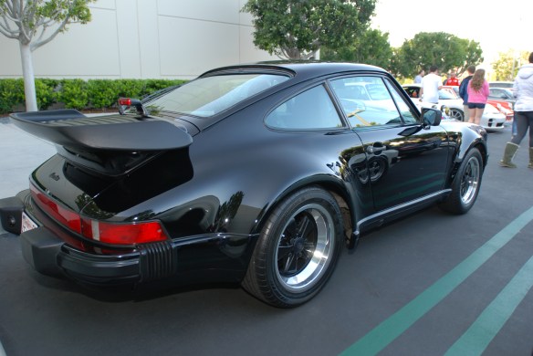 Black  on black 1987 Porsche 930 Turbo_3/4 rear view with reflections_Cars&Coffee/Irvine_9/30/13