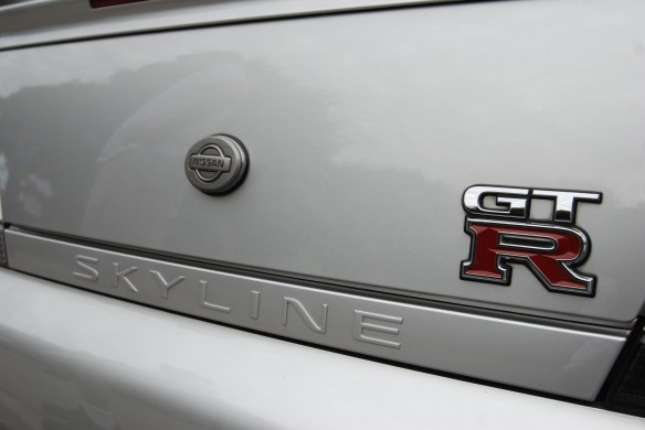 Silver right hand drive Nissan Skyline GTR_ rear trunk badging detail_Cars&Coffee_August 31, 2013