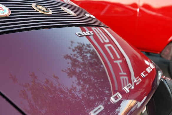 Aubergine 1973 Porsche 911T coupe_ RGruppe member_rear deckled with red Porsche bus reflections_cars&coffee_10/19/13
