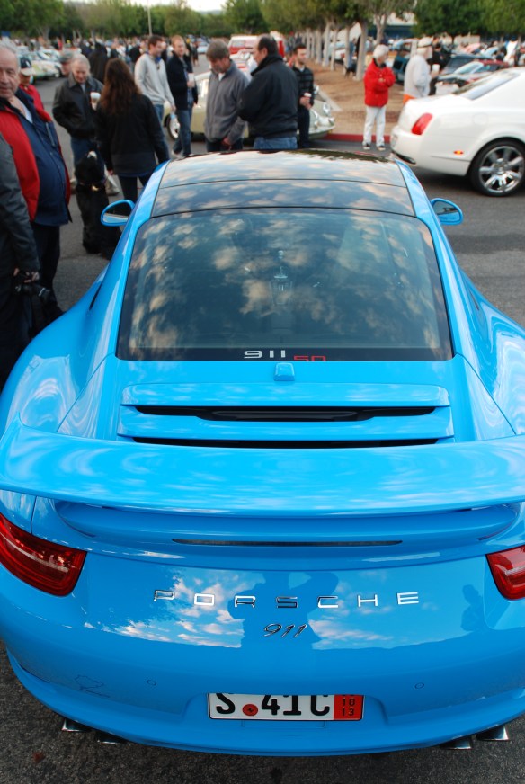 2014 Riviera Blue Porsche 991 with Aerokit Cup option_ rear view of rear wing and optional 911 badging with cloud reflections_cars&coffee/irvine_November 30, 2013