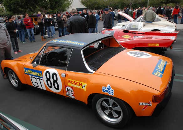 1970 Signal Orange Lufthansa Porsche 914-6 GT with Porsche race cars_ 3/4 rear group shot_cars&coffee/irvine_january 25, 2014