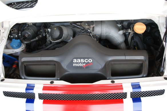 white w/red and blue stripe, all star # 28  Porsche  type 997 GT3 Cup car_ view of motor _California Festival of Speed_4/5/14