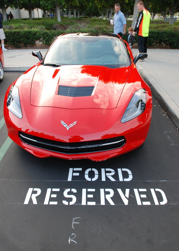Red Corvette C7_front view w/reflections & Ford reserved painted parking space graphic_cars&coffee_October 18, 2014